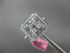 ESTATE LARGE .82CT ROUND & BAGUETTE DIAMOND 18KT WHITE GOLD HALO ENGAGEMENT RING