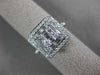 ESTATE LARGE .82CT ROUND & BAGUETTE DIAMOND 18KT WHITE GOLD HALO ENGAGEMENT RING