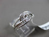 ESTATE WIDE .34CT BAGUETTE & ROUND DIAMOND 18KT WHITE GOLD 3D INFINITY LOVE RING