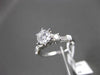 ESTATE 1.12CT ROUND & BAGUETTE DIAMOND 14KT WHITE GOLD SOLITAIRE ENGAGEMENT RING