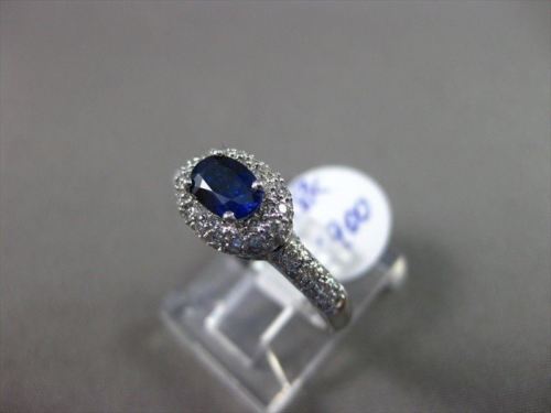 ESTATE 1.03CT DIAMOND & AAA SAPPHIRE 18KT WHITE GOLD HALO DESIGN ENGAGEMENT RING