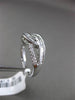 ESTATE WIDE .34CT BAGUETTE & ROUND DIAMOND 18KT WHITE GOLD 3D INFINITY LOVE RING