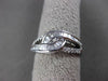 ESTATE WIDE .34CT BAGUETTE & ROUND DIAMOND 18KT WHITE GOLD 3D INFINITY LOVE RING