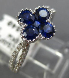 ESTATE 1.23CT DIAMOND & SAPPHIRE 18KT WHITE GOLD FILIGREE INVISIBLE FLOWER RING