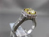 ESTATE 2.26CTW GIA FANCY YELLOW DIAMOND 18KT WHITE GOLD HALO ENGAGEMENT RING