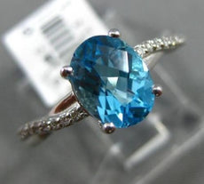 ESTATE 1.67CT DIAMOND & BLUE TOPAZ 18KT WHITE GOLD INFINITY LOVE ENGAGEMENT RING