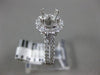 ESTATE .69CT DIAMOND 14KT WHITE GOLD FOUR PRONG HALO SEMI MOUNT ENGAGEMENT RING
