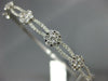 1.24CT DIAMOND 18KT WHITE GOLD 3D FLOWER CLUSTER SEMI ETERNITY BANGLE BRACELET