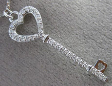 ESTATE .17CT DIAMOND 18KT WHITE GOLD HANDCRAFTED KEY TO YOUR HEART LOVE PENDANT