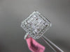 ESTATE LARGE .82CT ROUND & BAGUETTE DIAMOND 18KT WHITE GOLD HALO ENGAGEMENT RING