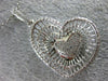 ESTATE .58CT DIAMOND 18KT WHITE GOLD 3D PAVE MULTI HEART FLOATING LOVE PENDANT