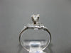 ESTATE .54CT ROUND & BAGUETTE DIAMOND 18K WHITE GOLD 3D INFINITY ENGAGEMENT RING