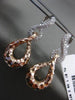 ESTATE LARGE 1.1CT DIAMOND 14KT WHITE & ROSE GOLD 3D LOVE KNOT HANGING EARRINGS