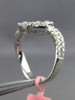 ESTATE 1.47CT ROUND & BAGUETTE DIAMOND 18KT WHITE GOLD SQUARE CRISS CROSS RING