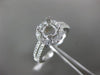 ESTATE .69CT DIAMOND 14KT WHITE GOLD FOUR PRONG HALO SEMI MOUNT ENGAGEMENT RING
