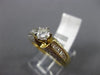 ESTATE 1.20CT ROUND & BAGUETTE DIAMOND 14KT YELLOW GOLD CLASSIC ENGAGEMENT RING