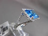 ESTATE 11.42CTW DIAMOND & AAA EMERALD CUT BLUE TOPAZ 14KT WHITE GOLD HALO RING