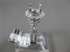 ESTATE .69CT DIAMOND 14KT WHITE GOLD FOUR PRONG HALO SEMI MOUNT ENGAGEMENT RING