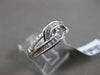 ESTATE WIDE .34CT BAGUETTE & ROUND DIAMOND 18KT WHITE GOLD 3D INFINITY LOVE RING