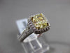 ESTATE 2.26CTW GIA FANCY YELLOW DIAMOND 18KT WHITE GOLD HALO ENGAGEMENT RING