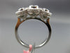 ESTATE .92CT DIAMOND 18KT WHITE GOLD 3 STONE PAST PRESENT FUTURE HALO BEZEL RING