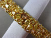 ESTATE WIDE 25.30CT WHITE FANCY NATURAL YELLOW DIAMOND 18K GOLD TENNIS BRACELET