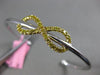 ESTATE .73CT WHITE & FANCY YELLOW DIAMOND 18KT 2 TONE GOLD INFINITY LOVE BANGLE