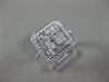 ESTATE LARGE .82CT ROUND & BAGUETTE DIAMOND 18KT WHITE GOLD HALO ENGAGEMENT RING