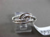 ESTATE WIDE .34CT BAGUETTE & ROUND DIAMOND 18KT WHITE GOLD 3D INFINITY LOVE RING