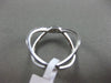 ESTATE WIDE .31CT DIAMOND 18KT WHITE GOLD 3D CRISS CROSS OPEN INFINITY LOVE RING