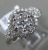 ESTATE WIDE .69CT DIAMOND 18KT WHITE GOLD 3D HALO CLUSTER FRIENDSHIP LOVE RING