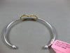 ESTATE .73CT WHITE & FANCY YELLOW DIAMOND 18KT 2 TONE GOLD INFINITY LOVE BANGLE