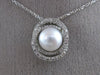 ESTATE .18CT DIAMOND & AAA SOUTH SEA PEARL 14KT WHITE GOLD 3D LOVE KNOT PENDANT