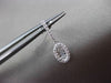 ESTATE .30CT BAGUTTE & ROUND DIAMOND 14KT WHITE GOLD OVAL HANGING EARRINGS