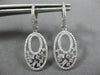 ESTATE .75CT ROUND AND BAGUETTE DIAMOND 14KT WHITE GOLD 3D OVAL HANGING EARRINGS