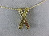 ESTATE .42CT DIAMOND & AAA RUBY 14KT YELLOW GOLD CLASSIC X LOVE FLOATING PENDANT