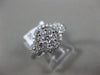 ESTATE WIDE .69CT DIAMOND 18KT WHITE GOLD 3D HALO CLUSTER FRIENDSHIP LOVE RING