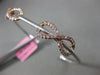 ESTATE .87CT WHITE & PINK DIAMOND 18K WHITE & ROSE GOLD INFINITY BANGLE BRACELET
