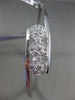 ESTATE .10CT DIAMOND 14KT WHITE GOLD THREE STONE FLOWER CLUSTER BANGLE BRACELET
