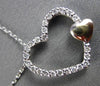 ESTATE .25CT DIAMOND 14KT TWO TONE GOLD FLOATING DOUBLE HEART PENDANT & CHAIN