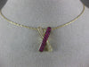 ESTATE .42CT DIAMOND & AAA RUBY 14KT YELLOW GOLD CLASSIC X LOVE FLOATING PENDANT