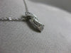 ESTATE SMALL .16CT ROUND DIAMOND 14KT WHITE GOLD INFINITY FLOATING LOVE PENDANT