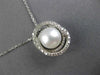 ESTATE .18CT DIAMOND & AAA SOUTH SEA PEARL 14KT WHITE GOLD 3D LOVE KNOT PENDANT