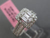 ESTATE LARGE .66CT ROUND & BAGUETTE DIAMOND 18KT WHITE GOLD HALO ENGAGEMENT RING