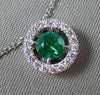 ESTATE .41CT DIAMOND & EMERALD 18KT WHITE GOLD CLASSIC HALO FLOATING PENDANT E/F