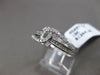 ESTATE .26CT BAGUETTE & ROUND DIAMOND 18KT WHITE GOLD 3D INFINITY LOVE FUN RING