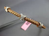 ESTATE .27CT DIAMOND 14KT WHITE & ROSE GOLD X LOVE WAVE FLEXIBLE BANGLE BRACELET