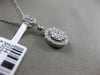 ESTATE .58CT DIAMOND 18KT WHITE GOLD 3D CLUSTER HALO ETOILE FLOATING PENDANT F/G