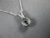 ESTATE .45CT DIAMOND & AAA EMERALD 14KT WHITE GOLD ROUND & OVAL FLOATING PENDANT