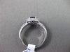 ESTATE 1.03CT DIAMOND & AAA SAPPHIRE 18KT WHITE GOLD HALO DESIGN ENGAGEMENT RING